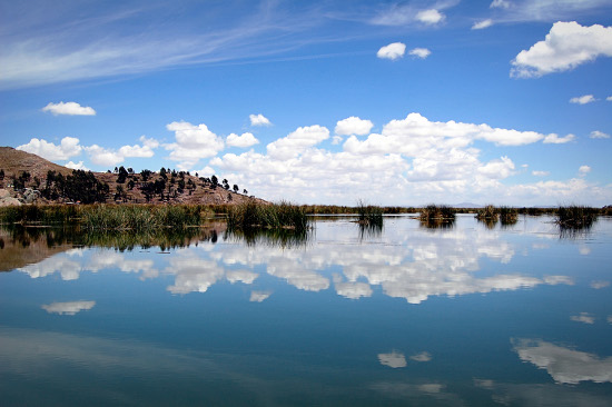 Boat ride out to Uros Uros Islands in Lake Titicaca off the coast of Puno, Peru