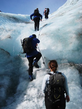 Hiking in a group-Franz Josef Glacier-New Zealand Ice climbing at Franz Josef Glacier in New Zealand